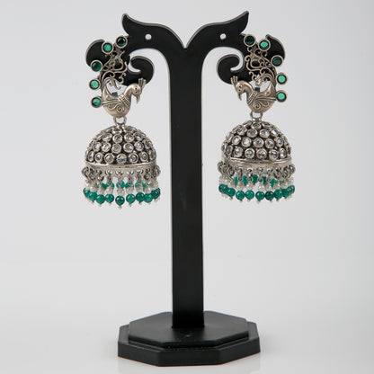 Krishnacrafts Sterling Silver Handcrafted Peacock Jhumka with Green Bead Drops.