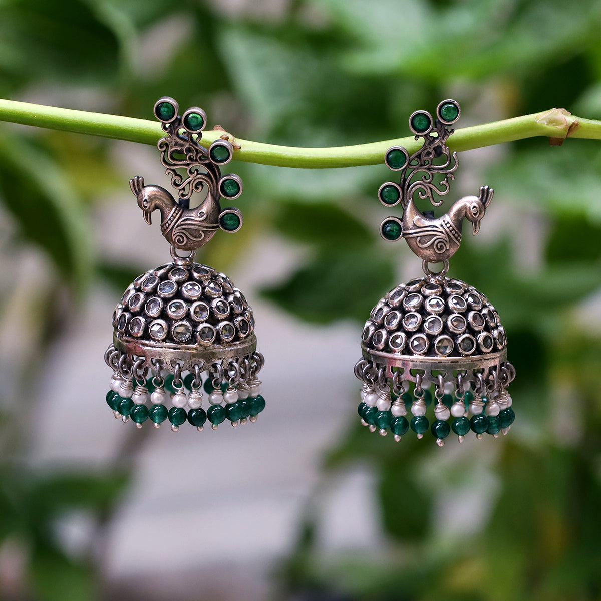Krishnacrafts Sterling Silver Handcrafted Peacock Jhumka with Green Bead Drops.